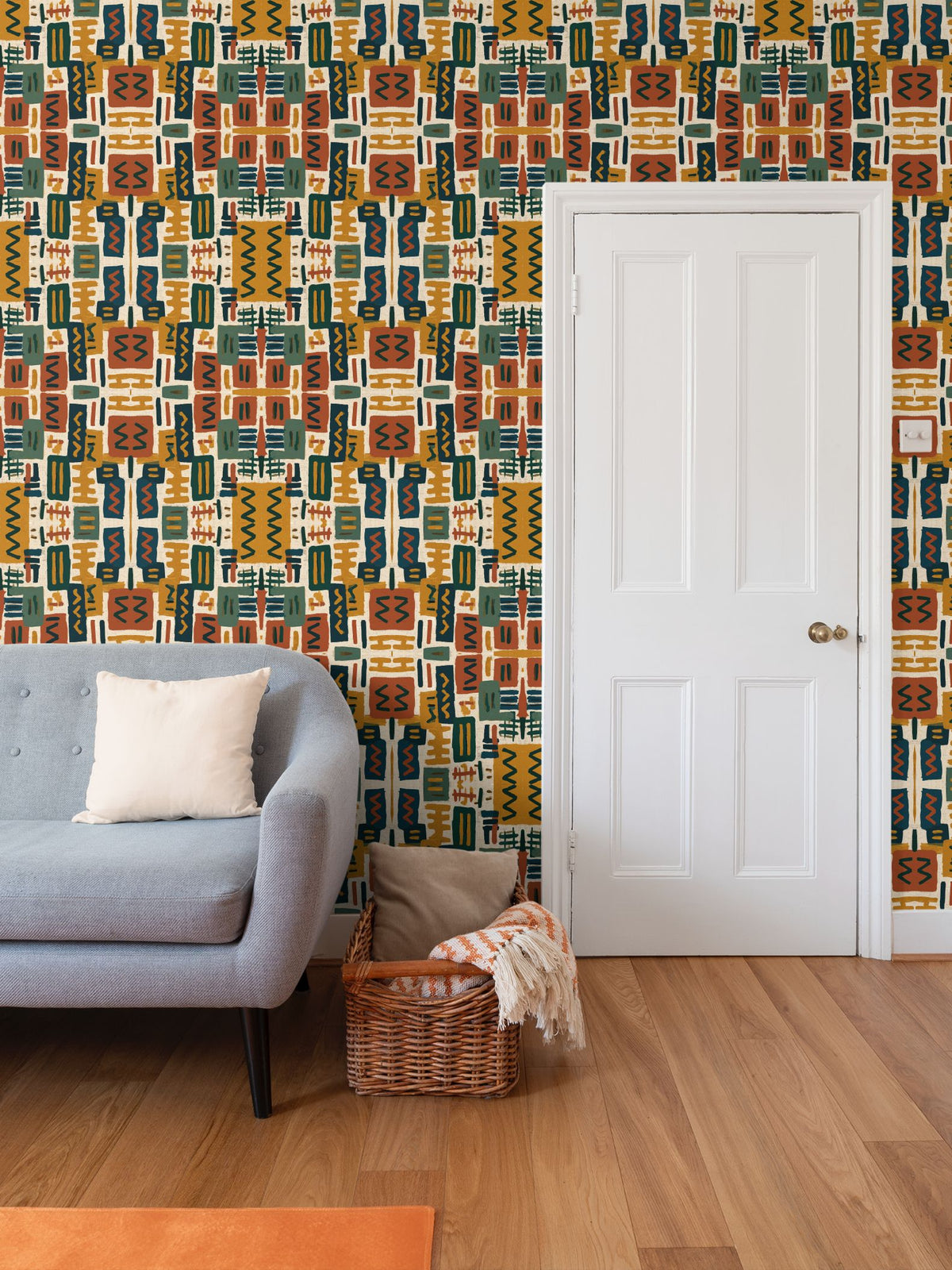 Mirrored Column pattern — mirrored geometric forms in rust, gold, forest green, and navy on cream